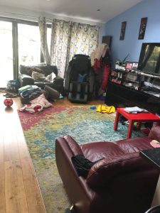 messy living room before move out cleaning service