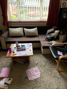 messy living room in surbiton before a professional cleaning service