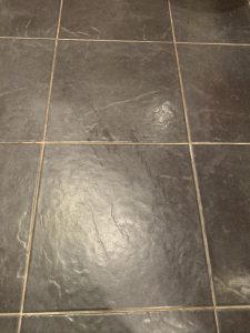ceramic floor with dirty tiles before polishing