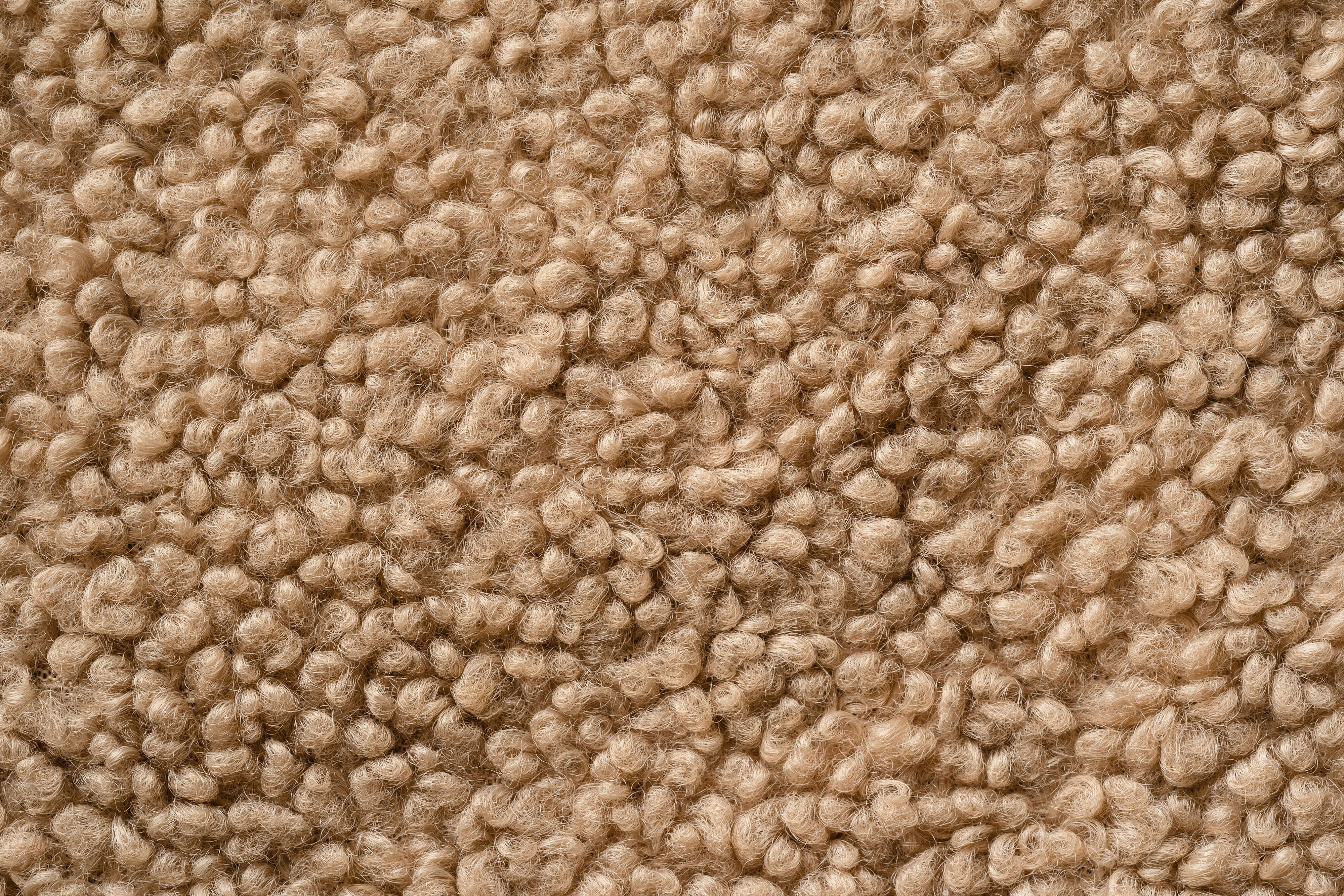 Identify the material of the carpet