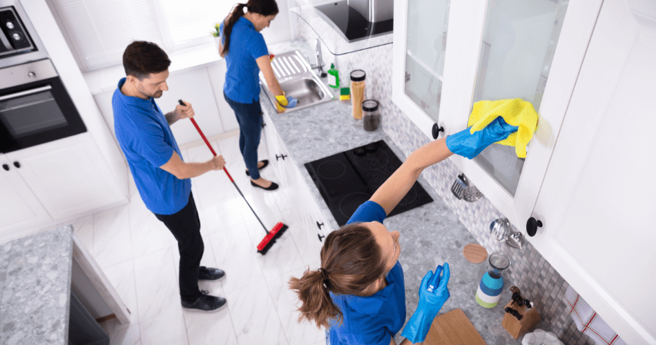 three cleaners work hard during an end of tenancy cleaning service