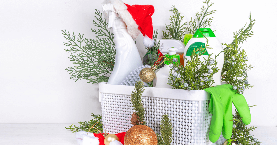 cleaning materials in basket arranged with christmas ornaments