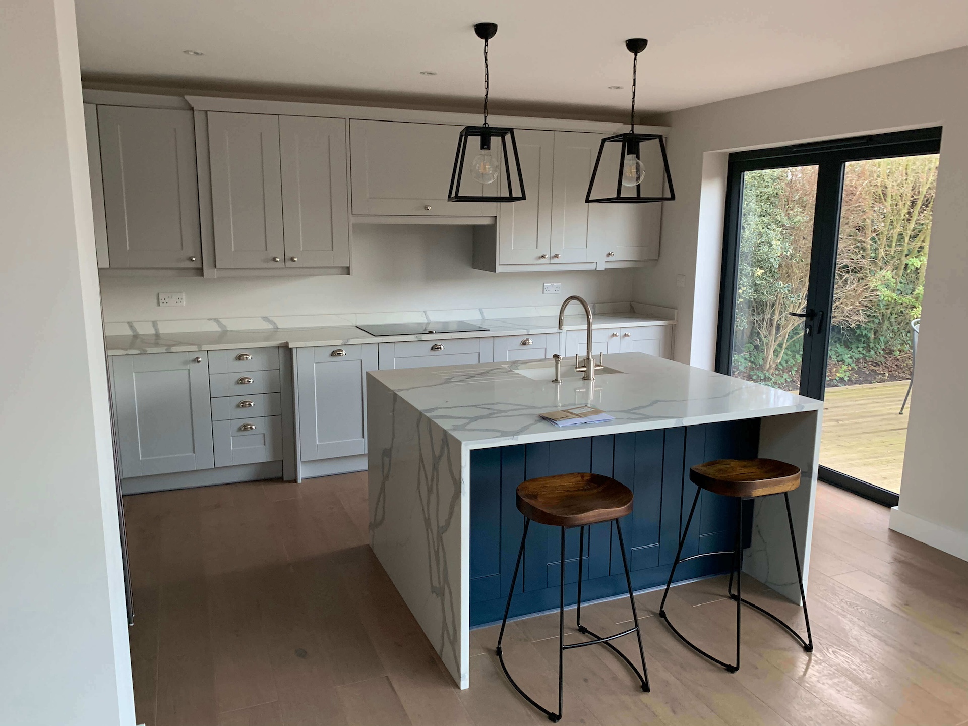 Spotless and sparkling kitchen in Ealing W5, perfectly cleaned after an end of tenancy cleaning service by Cleaningsure, showcasing a pristine countertop, gleaming appliances, and a clean floor.